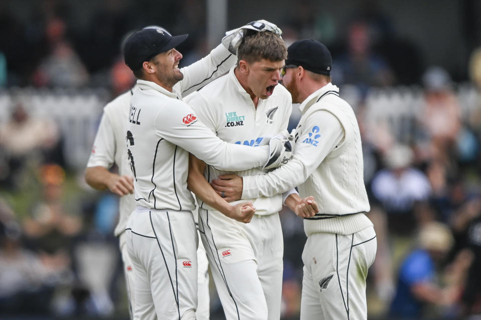 New Zealand's Ben Sears, centre, celebrates with teammates after dismissing Australia's Mitch Marsh on day four of the second cricket test between New Zealand and Australia in Christchurch, New Zealand, Monday, March 11, 2024. (John Davidson/Photosport via AP)