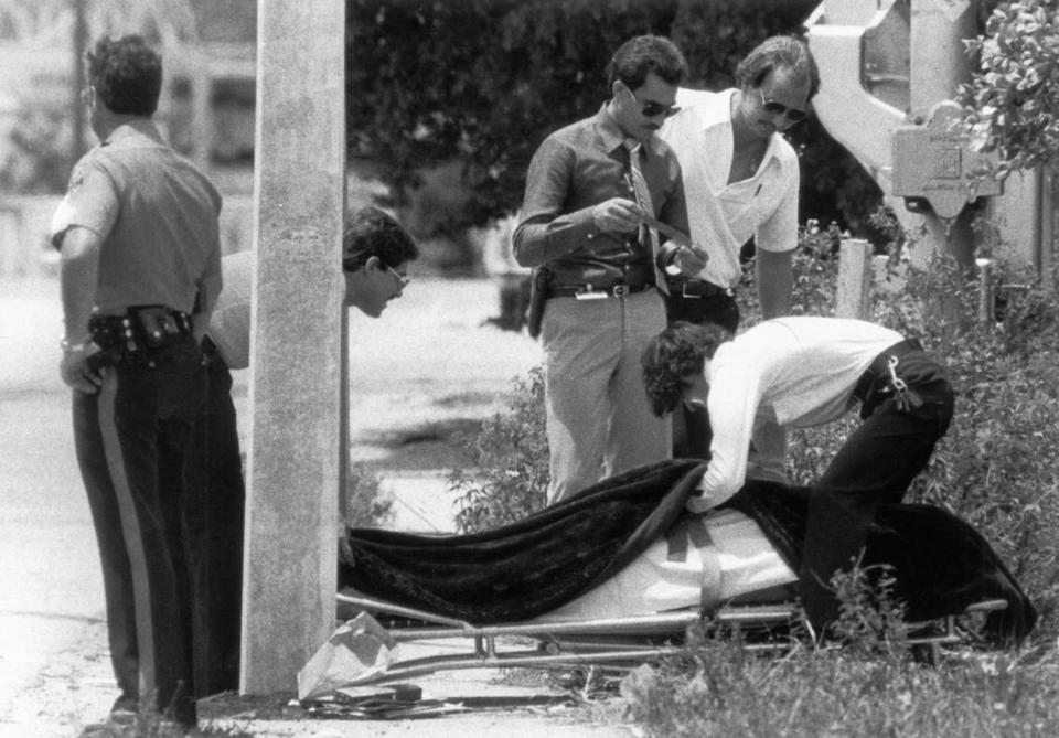 The body of Carl R, Brown is removed by police he left eight men and women dead and three others wounded at Bob Moore’s Welding and Machine Service, 3147 NW North River Dr. during a shooting rampage in August of 1982. Brown was killed when an outraged motorist who knew the victims deliberately crushed him against a concrete light pole with his car. Brown killed owner Bob Moore’s mother, Ernestine Moore, 67; his uncle, Mangum Moore, 78, the bookkeeper; Carl Lee, 47, the manager