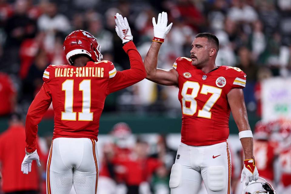 <p>Dustin Satloff/Getty</p>  Travis Kelce #87 of the Kansas City Chiefs high-fives Marquez Valdes-Scantling #11 prior to the game New York Jets at MetLife Stadium on October 01, 2023 in East Rutherford, New Jersey