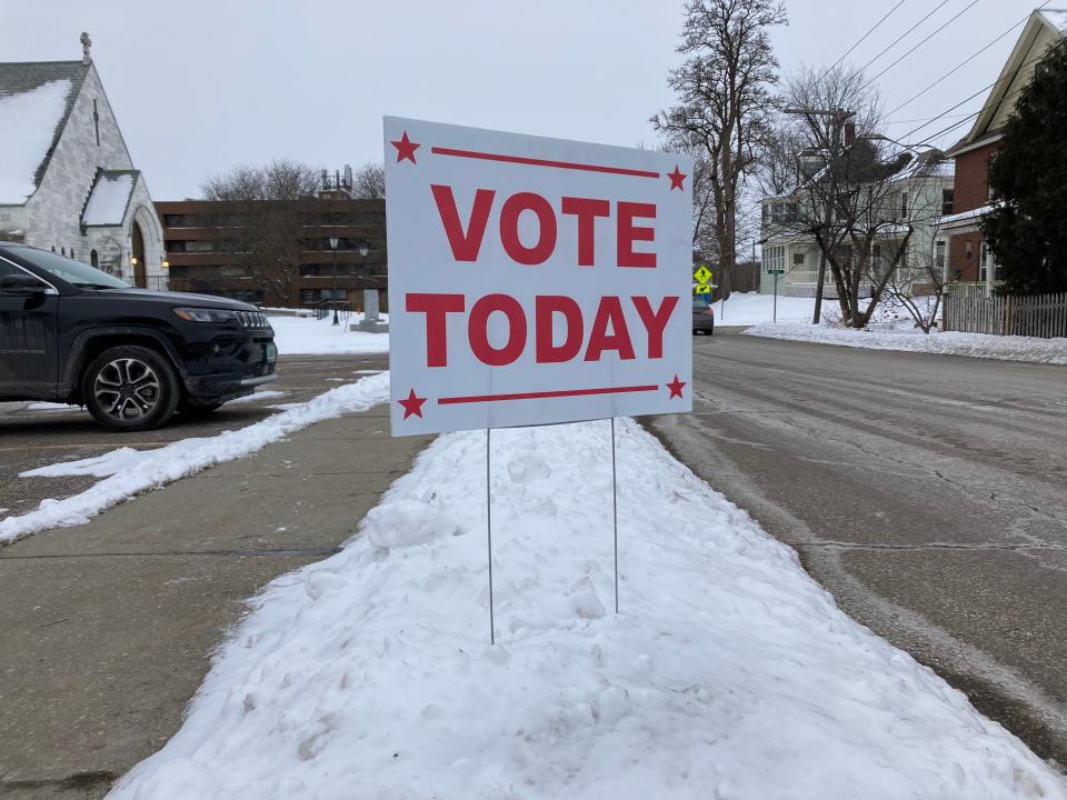 A voting sign sticks out of the snow outside the Winooski Senior Center on March 1, 2022. Noncitizens could vote for the first time after the state legislature approved Winooski's charter change that allowed for all-resident voting in local elections, regardless of citizenship status.