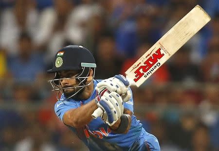 Cricket - West Indies v India - World Twenty20 cricket tournament semi-final - Mumbai, India - 31/03/2016. India's Virat Kohli plays a shot. REUTERS/Danish Siddiqui