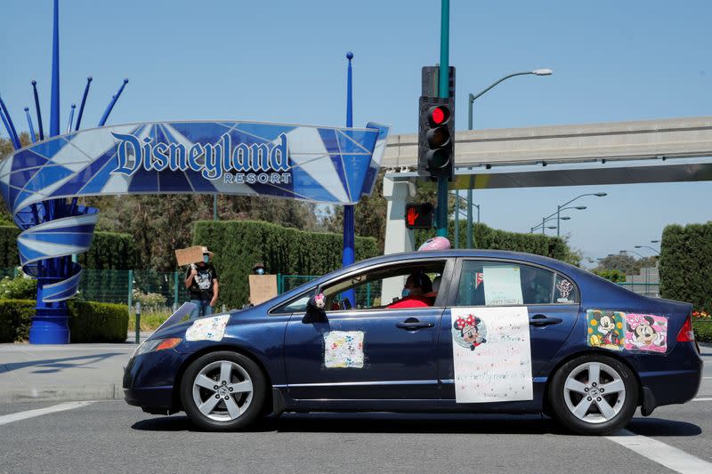 Disney cast members stage a car caravan outside Disneyland California, calling for higher safety standards for Disneyland to reopen