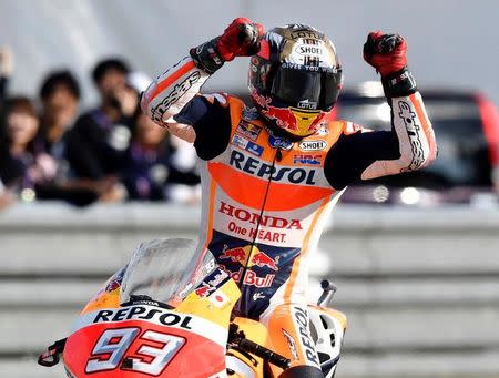 Honda MotoGP rider Marc Marquez of Spain celebrates after winning the Japanese Grand Prix and secured his third MotoGP championship in four years at the Twin Ring Motegi circuit in Motegi, Japan, October 16, 2016 in this photo released by Kyodo. Mandatory credit Kyodo/via REUTERS