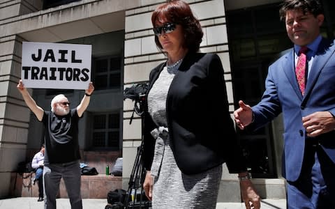 Manafort's wife Kathleen leaves court. The couple's children did not attend the trial - Credit: AP