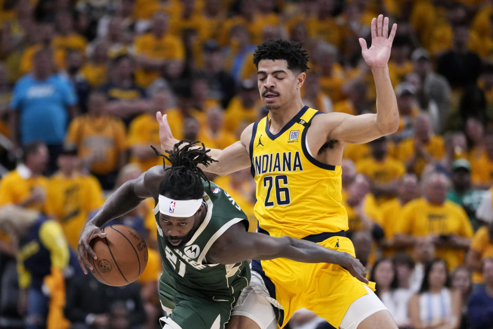 Milwaukee Bucks guard Patrick Beverley (21) drives up court past Indiana Pacers guard Ben Sheppard (26) during the second half in Game 6 in an NBA basketball first-round playoff series, Thursday, May 2, 2024, in Indianapolis. (AP Photo/Michael Conroy)
