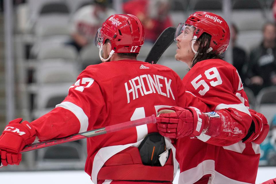 Detroit Red Wings left wing Tyler Bertuzzi (59) is congratulated by Filip Hronek (17) after scoring a goal against the San Jose Sharks during the second period of an NHL hockey game Tuesday, Jan. 11, 2022, in San Jose, Calif.