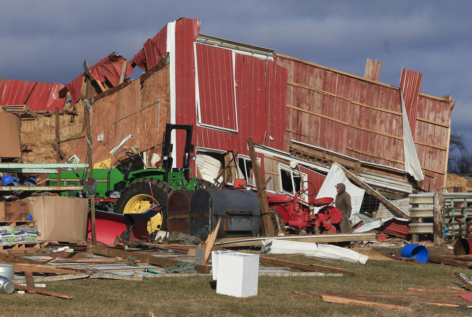 Debris covers the remains of a Rock County, Wis. barn on Friday, Feb. 9, 2024. The first tornado ever recorded in Wisconsin in the usually frigid month of February came on a day that broke records for warmth, the type of severe weather normally seen in the late spring and summer. ( John Hart/Wisconsin State Journal via AP)