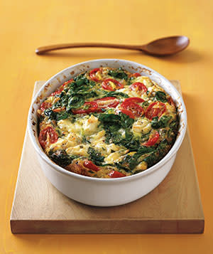 <p>It takes just 10 minutes to assemble this tasty frittata—and the red and green of tomatoes and spinach make it a healthy (and very Christmassy) treat. </p>