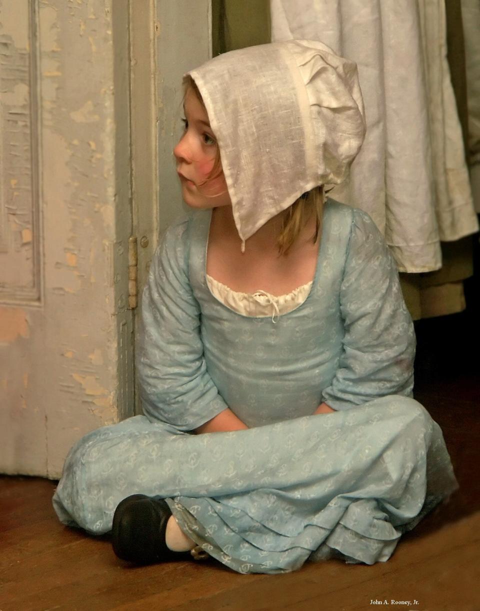Photographer John A. Rooney Jr.'s favorite image named "Laura." He captured this little girl donning Colonial attire at a Revolutionary War Reenactment held at historic Battersea in Petersburg. In photography competitions, the portrait placed second and received an Honorable Mention as well.