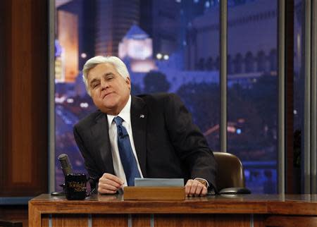 Host Jay Leno sits at his desk during a commercial break while taping the last episode of "The Tonight Show with Jay Leno" in Burbank, California February 6, 2014. REUTERS/Mario Anzuoni