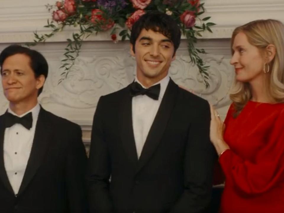oscar diaz, alex, and ellen claremont standing together in red white and royal blue in formal wear