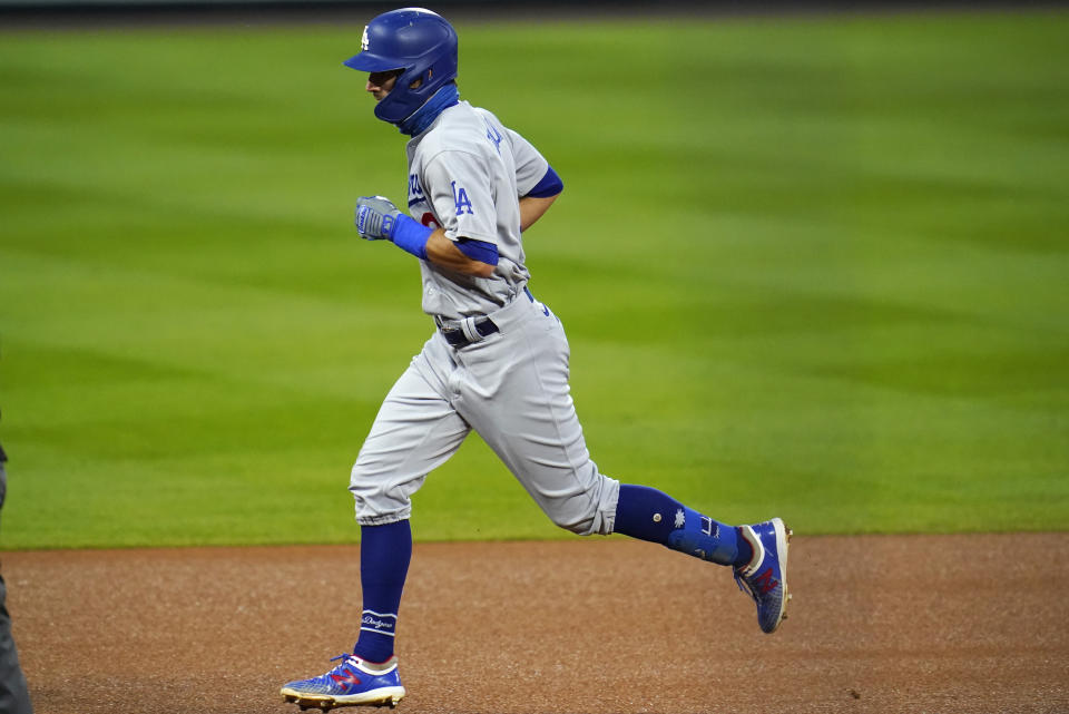 Los Angeles Dodgers' Chris Taylor runs the bases on a solo home run off Colorado Rockies starting pitcher Chi Chi Gonzalez during the fourth inning of a baseball game Saturday, Sept. 19, 2020, in Denver. (AP Photo/David Zalubowski)