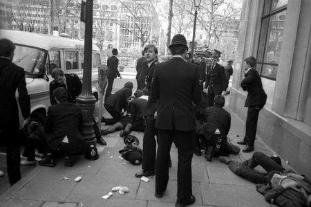 Police officers surround police constable Yvonne Fletcher after she was shot during a protest against Libyan leader Colonel Muammar Gaddafi in London, in this file photograph dated April 17, 1984. REUTERS/Clive Challis/files