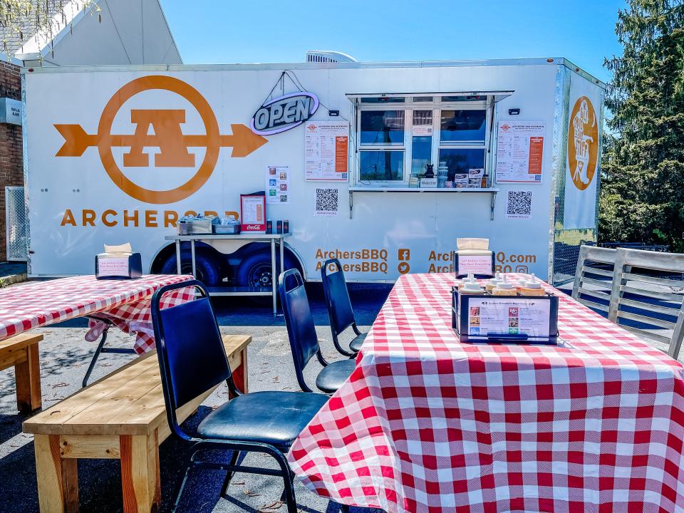 Tables, chairs and sauces are available for Archer’s BBQ to tuck into their orders outside the new food truck in Seymour, April 19, 2022.