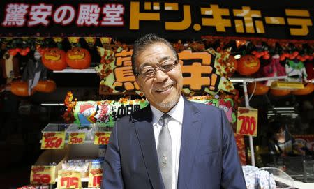 Japanese discount store operator Don Quijote Holdings CEO Takao Yasuda poses for a photo at Don Quijote's central branch store in Tokyo in this September 30, 2014 file photo. REUTERS/Toru Hanai/Files