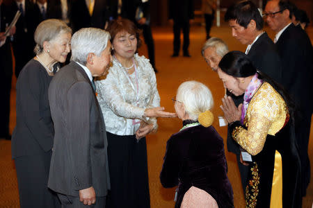 Japanese Emperor Akihito and Empress Michiko meet with family members of Japanese veterans living in Vietnam, at a hotel in Hanoi, Vietnam, March 2, 2017. REUTERS/Minh Hoang/Pool