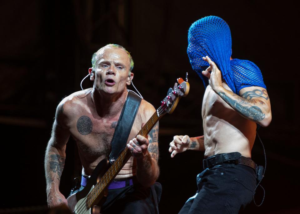 Red Hot Chili Peppers' Flea (left) and Anthony Kiedis perform at Comerica Park in Detroit on Sunday, Aug. 14, 2022.