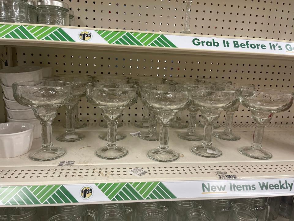 Margarita glasses on a shelf with a $1.25 price tag.