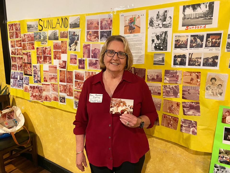 Pamela Hammock, former principal of Sunland Hospital's Sunland Public School, holds up an old photo during a Sunland Hospital workers reunion in Tallahassee on March 8, 2024.