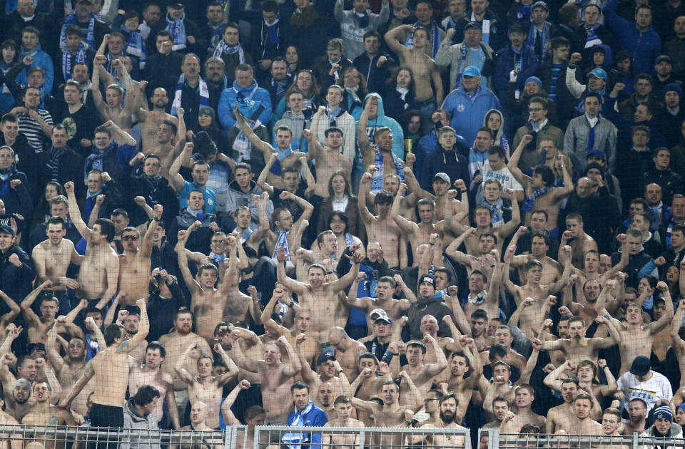 Zenit supporters celebrate during the Champions League round of 16 second leg soccer match between Borussia Dortmund and FC Zenit in Dortmund, Germany, Wednesday, March19,2014. (AP Photo/Frank Augstein)