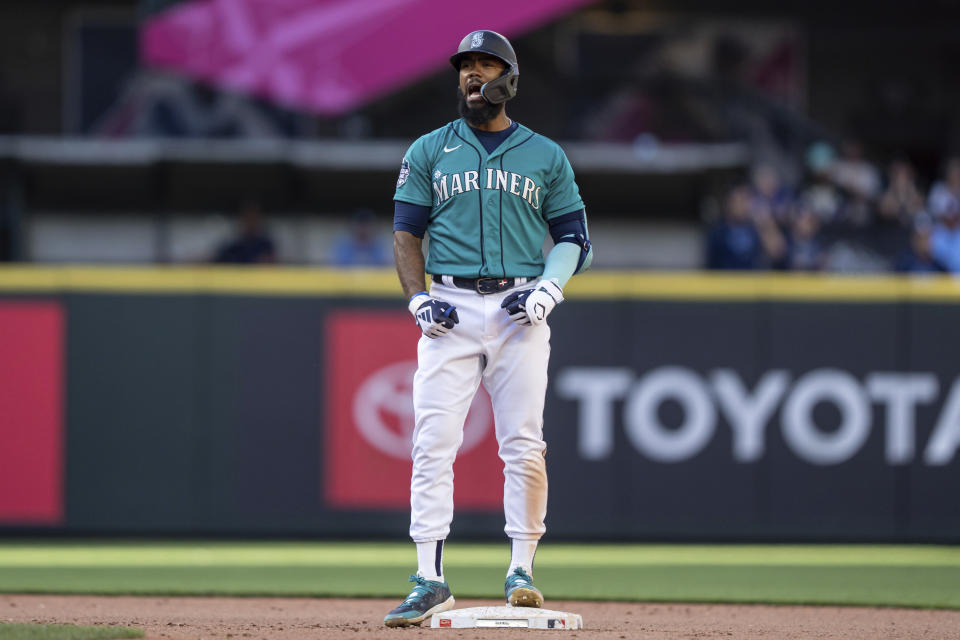 Seattle Mariners' Teoscar Hernandez reacts after hitting a two-run double off Tampa Bay Rays relief pitcher Jalen Beeks during the seventh inning of a baseball game, Saturday, July 1, 2023, in Seattle. (AP Photo/Stephen Brashear)