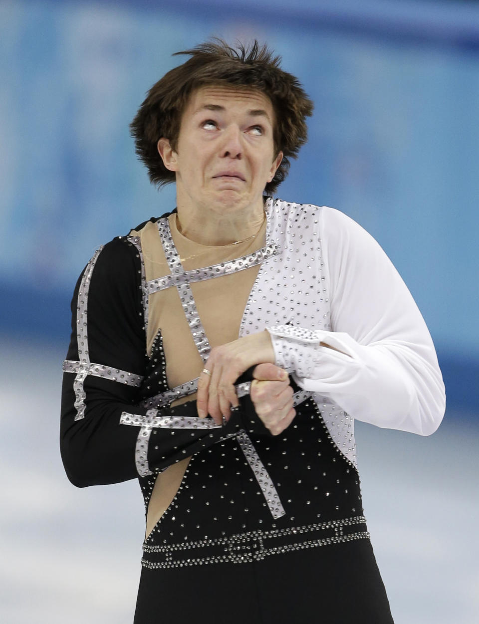 Yakov Godorozha of Ukraine competes in the men's short program figure skating competition at the Iceberg Skating Palace during the 2014 Winter Olympics, Thursday, Feb. 13, 2014, in Sochi, Russia. (AP Photo/Darron Cummings)