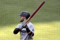 Miami Marlins' Eddy Alvarez holds a weighted bat as he stands at the on deck circle during the second inning in game one of a baseball double-header against the Baltimore Orioles, Wednesday, Aug. 5, 2020, in Baltimore. (AP Photo/Julio Cortez)