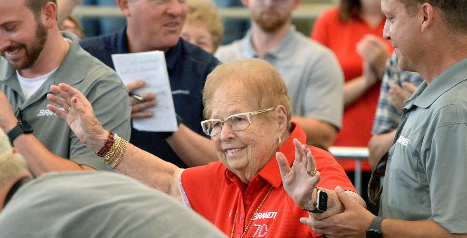 Evelyn Brandt Thomas acknowledges applause after the crowd at the Governor's Sale of Champions at the Illinois State Fair serenaded her with "Happy Birthday" on Wednesday. Brandt Thomas, one of the founders of Brandt Consolidated, turns 100 on Aug. 25.