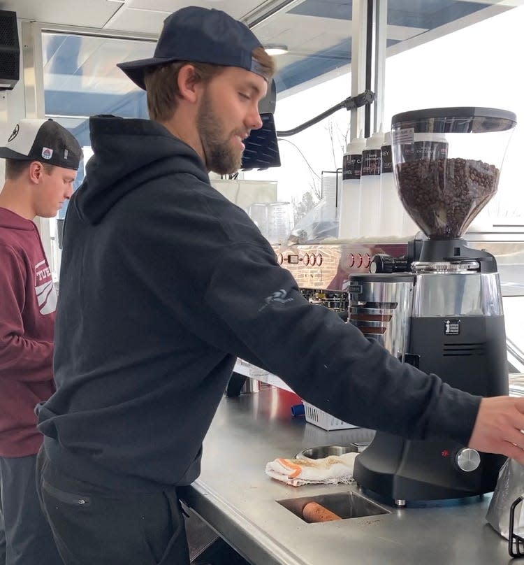 Matthew Koontz, right, and Davidson Reese make an iced blondie in January at South Carolina's first 7 Brew Coffee in Greenville.