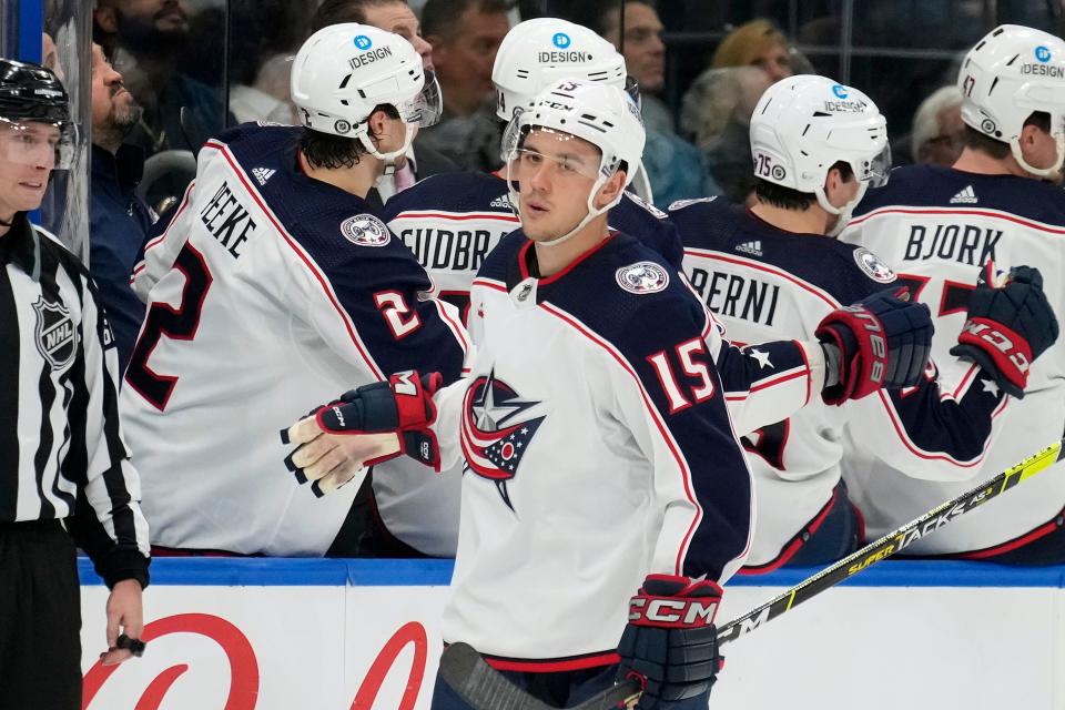 Columbus Blue Jackets defenseman Gavin Bayreuther (15) celebrates with the bench after his goal against the Tampa Bay Lightning during the second period of an NHL hockey game Tuesday, Jan. 10, 2023, in Tampa, Fla. (AP Photo/Chris O'Meara)