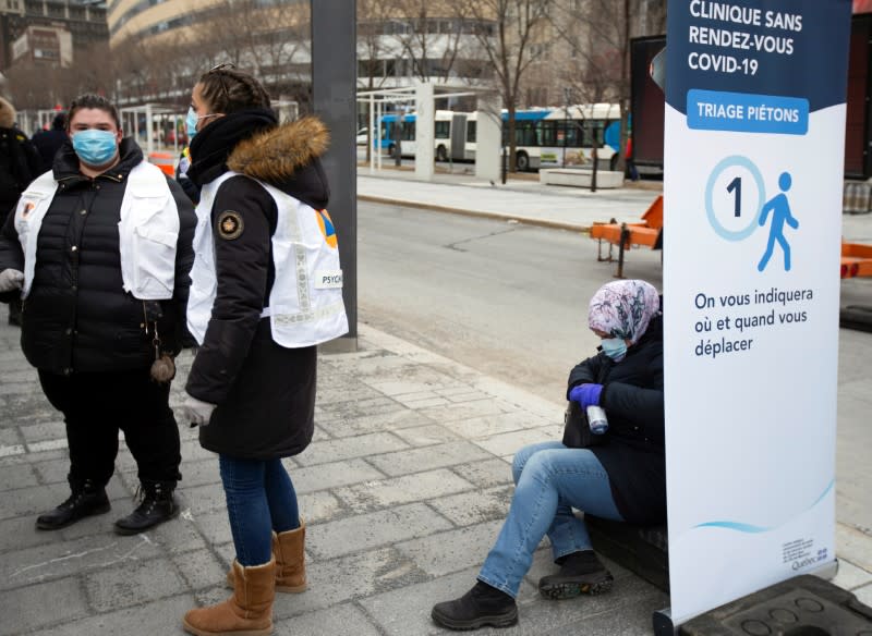 A woman sits as the city's public health unit holds a walk-in clinic testing for coronavirus disease (COVID-19) in Montreal