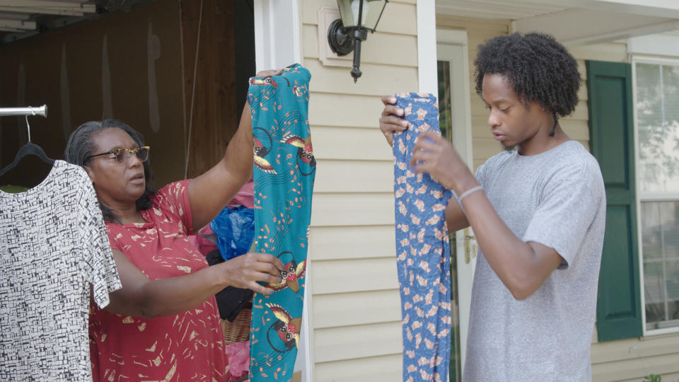 A man and woman hold up LuLaRoe leggings