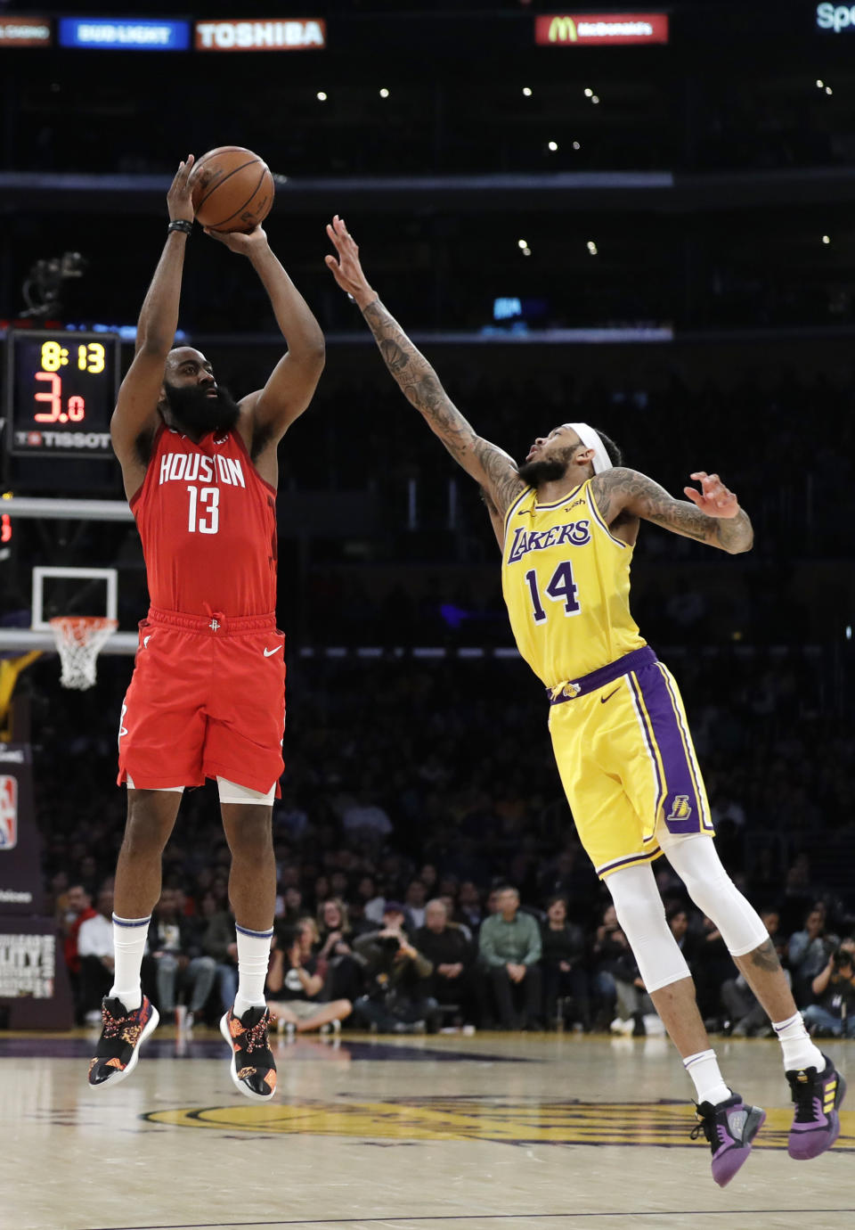 Houston Rockets' James Harden (13) shoots over Los Angeles Lakers' Brandon Ingram (14) during the second half of an NBA basketball game Thursday, Feb. 21, 2019, in Los Angeles. (AP Photo/Marcio Jose Sanchez)