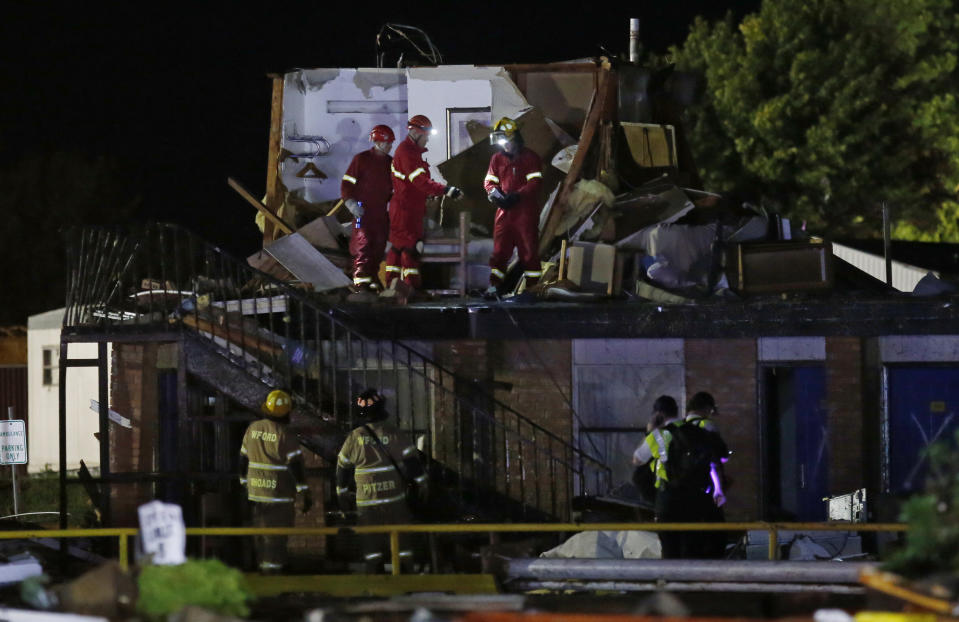 Emergency workers check what is left of the second floor of a hotel in El Reno, Okla., following a likely tornado touchdown on May 26. (Photo: Sue Ogrocki/AP)