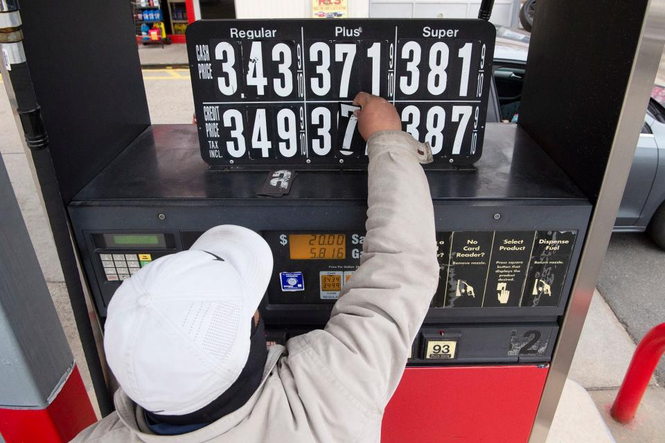 Gas station attendant Inderjeet Singh changes the price of the gas at the pump to show an increase at the Delta station on Broadway in Fair Lawn, N.J. on Thursday Feb. 24, 2022.