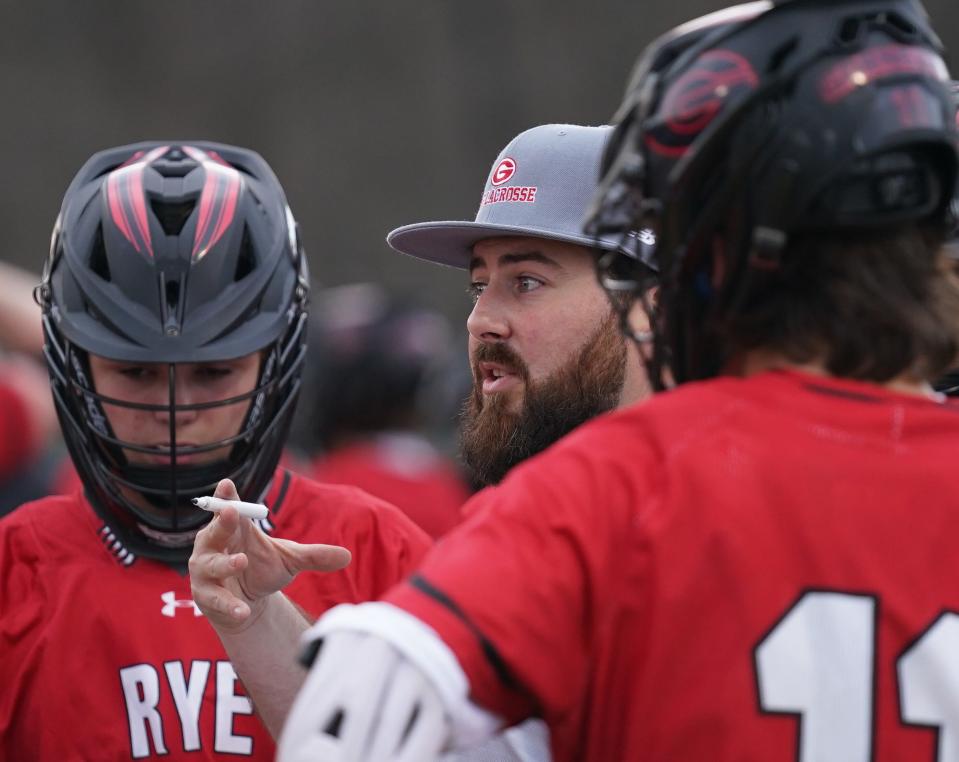 Rye head coach Steve Lennon on the sideline during their 11-5 win over Lakeland/Panas in boys lacrosse action at Lakeland High School in Shrub Oak on Tuesday, April 11, 2023. 