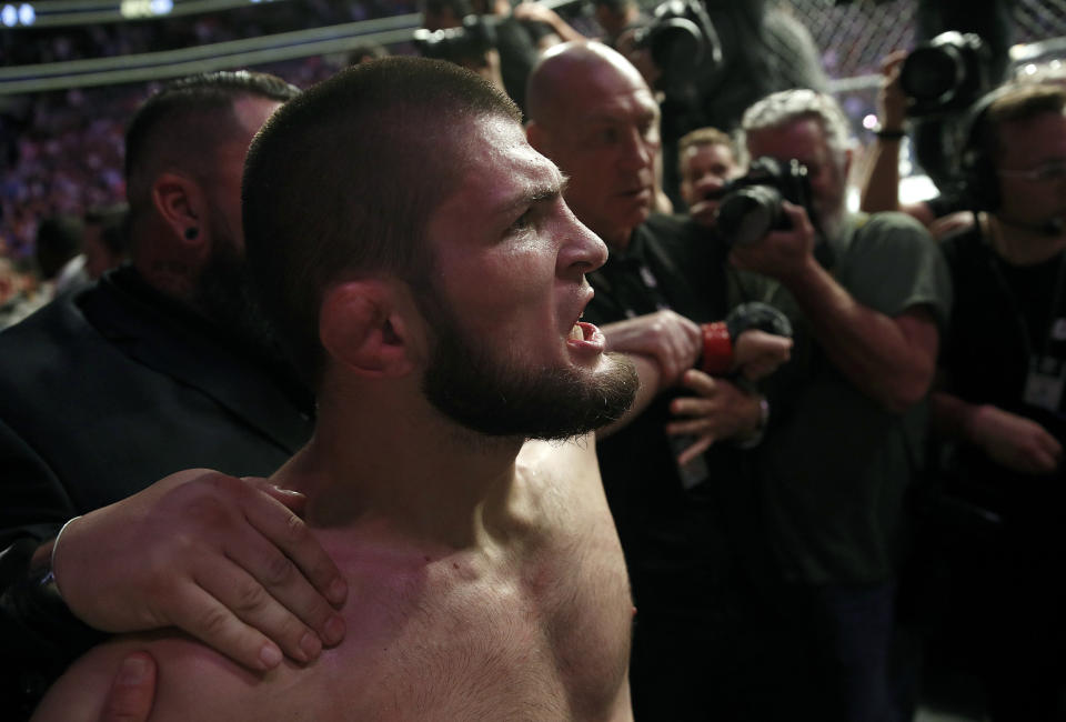 Three members of Khabib Nurmagomedov and Conor McGregor’s entourage had their suspensions extended on Wednesday following the post-fight brawl at UFC 229 last month. (AP Photo/John Locher)