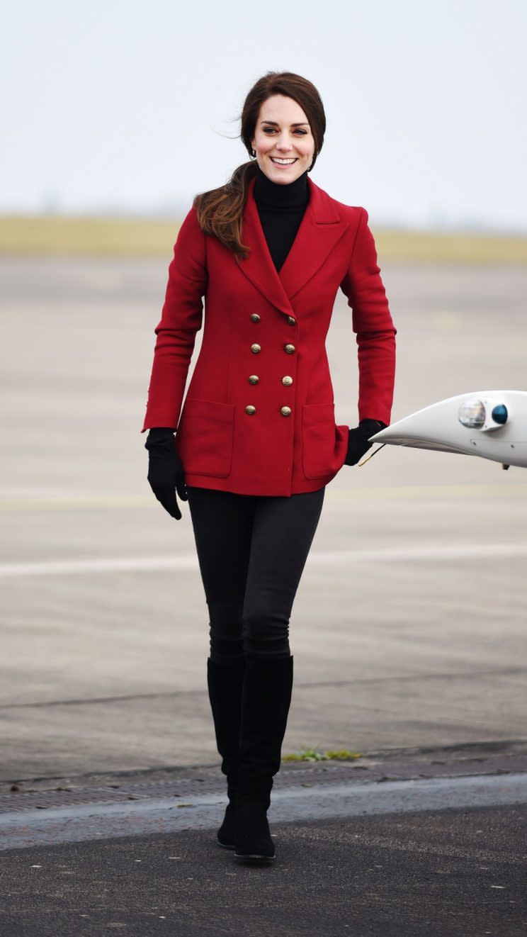 <i>Her black and red ensemble had a distinct military theme [Photo: PA]</i>