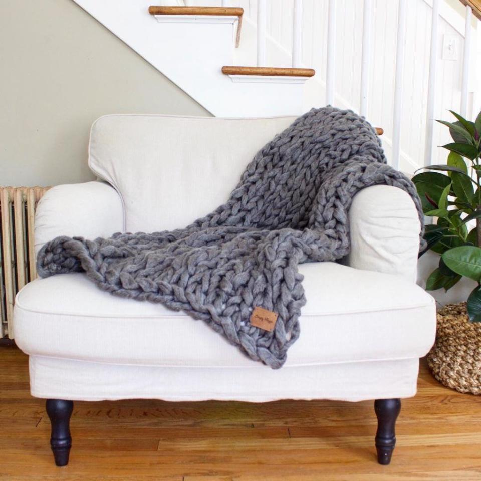 <p>Keep mom cozy with one of these chunky knit blankets. They're easy to make by hand (er, arm, as the case may be). </p><p><em><a href="http://www.simplymaggie.com/arm-knit-a-blanket-in-45-minutes" rel="nofollow noopener" target="_blank" data-ylk="slk:Get the tutorial at Simply Maggie »;elm:context_link;itc:0;sec:content-canvas" class="link ">Get the tutorial at Simply Maggie »</a></em></p>