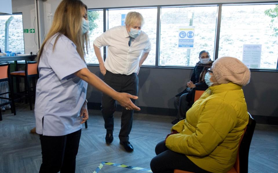 Boris Johnson meets staff and patients at Barnet FC's ground, The Hive, which is being used as a coronavirus vaccination centre - Reuters