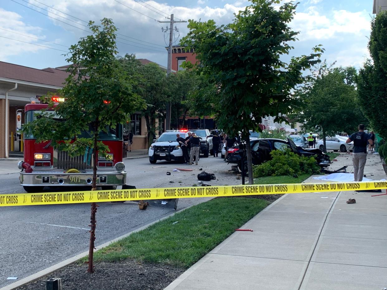 Pictured is one person being arrested after a crash at 5th and Monmouth streets in Northern Kentucky on Friday, April 7.