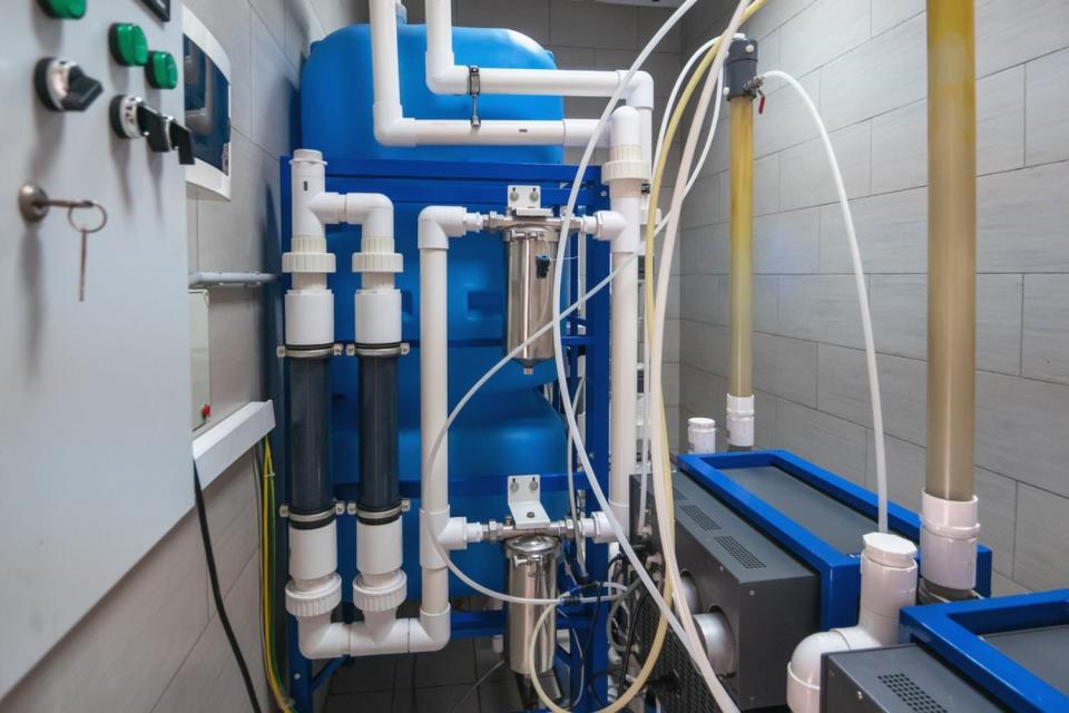 A close up of a whole house reverse osmosis system.