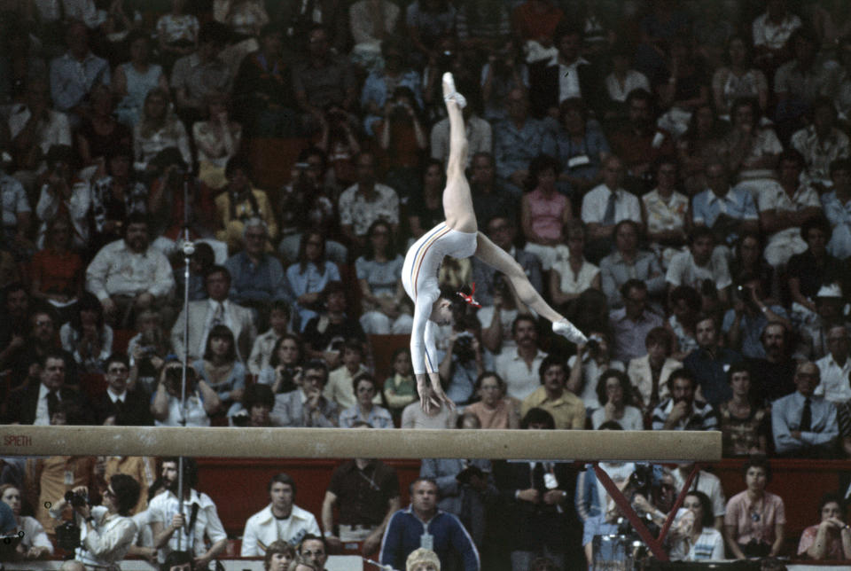 <p>The Romanian gymnast won three gold medals at the 1976 Games. She was the first female gymnast to be awarded a <a href="http://www.usghof.org/files/bio/n_comaneci/n_comaneci.html" target="_blank">perfect score of 10 in an Olympic gymnastics event</a> for her routine on the uneven bars. </p> <p>"You have to have a lot of passion for what you do," she told <a href="http://edition.cnn.com/2012/04/03/sport/olympics-nadia-comaneci/" target="_blank">CNN</a> in 2012. "To be able to work hard and to have a lot of motivation because you're going to go to places that you're never going to believe."</p>