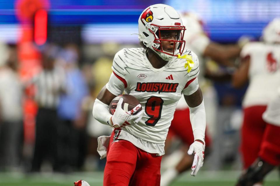 Louisville Cardinals wide receiver Ahmari Huggins-Bruce (9) runs the ball against the Georgia Tech Yellow Jackets in September at Mercedes-Benz Stadium.