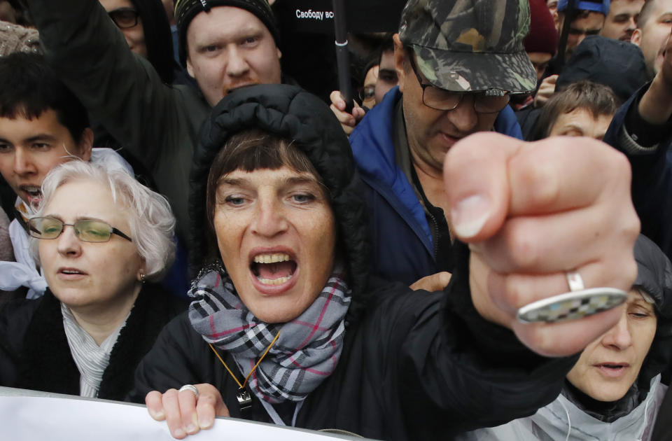 A woman shouts during a rally to support political prisoners in Moscow, Russia, Sunday, Sept. 29, 2019. (AP Photo/Dmitri Lovetsky)