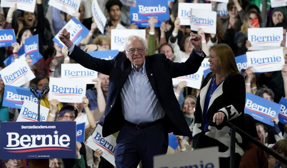 Democratic presidential hopeful Vermont Senator Bernie Sanders accompagnied by his wife Jane O'Meara Sanders arrives on stage for a 2020 Super Tuesday Rally at the Champlain Valley Expo in Essex Junction, Vermont March 3, 2020. (Photo by TIMOTHY A. CLARY / AFP) (Photo by TIMOTHY A. CLARY/AFP via Getty Images)