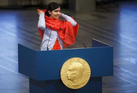 Nobel Peace Prize laureate Malala Yousafzai delivers a speech during the Nobel Peace Prize awards ceremony at the City Hall in Oslo December 10, 2014. REUTERS/Heiko Junge/NTB Scanpix/Pool