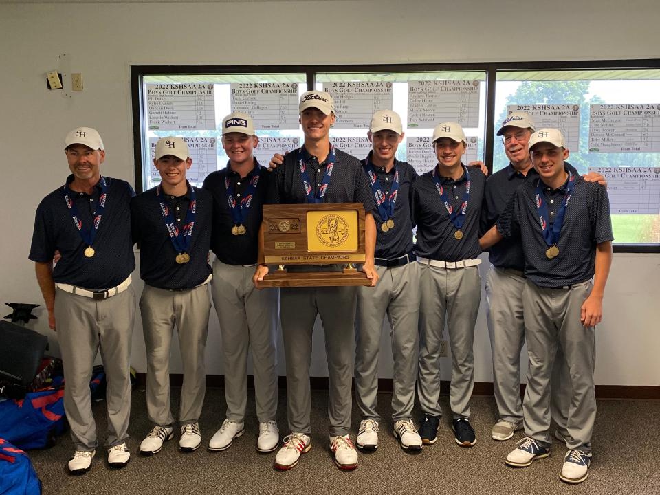 The Sacred Heart boys golf team poses for a picture with its state championship trophy Tuesday, May 24, 2022 at Emporia Municipal Golf Course.