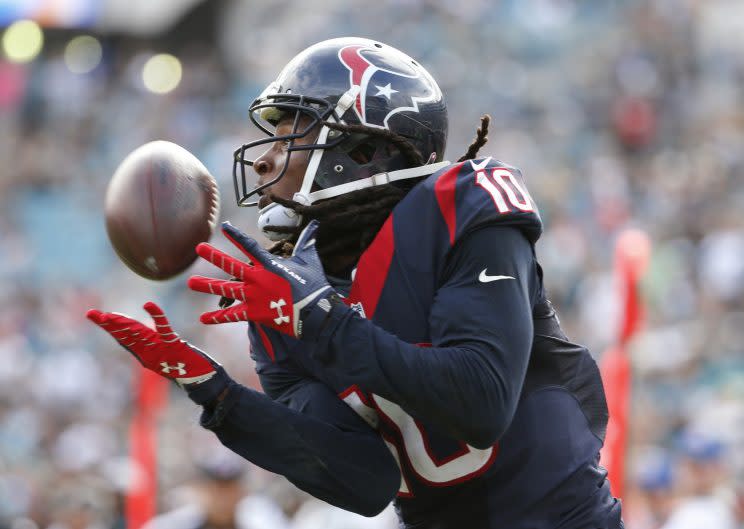 After a brief holdout, DeAndre Hopkins will report to Texans camp (AP)