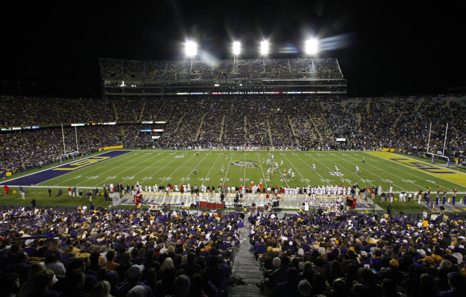 FILE - In this Nov. 12, 2011, file photo, LSU takes on Western Kentucky during the third quarter of an NCAA college football game in Baton Rouge. Defending league champion LSU wants to make already imposing Tiger Stadium even bigger, planning to borrow $75 million to add seats and suites and push the capacity at Death Valley past 100,000 by the 2014 season. That will give the SEC three stadiums with six-figure capacities _ Tennessee and Alabama are already there. (AP Photo/Gerald Herbert)